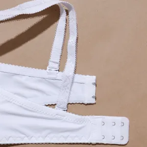 Close-up of white bra back strap, adjustable buckle and hook closure design.