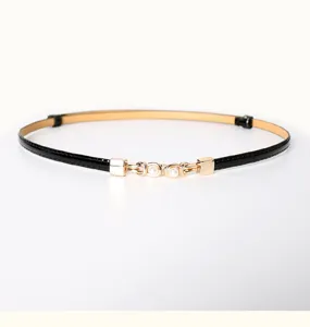 Slim black PU leather belt for women with elegant gold pearl buckle detail fashion accessory