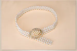 Pearl belt detail view, showcasing the elegant rhinestone-embellished golden buckle design.