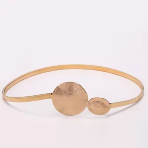 Gold metal elastic waist belt women dress accessory with double round decorative buckles.
