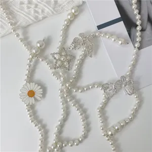 Exquisite pearl waist chain with sparkling rhinestone butterfly and star charms for dress.