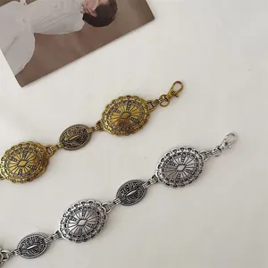 Vintage metal waist chain for women retro carved round design dress belt fashion accessory.