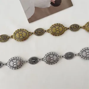 Vintage metal chain belt details, retro carved oval pieces, perfect dress accessory for women.