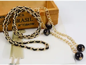 Elegant women's waist chain with interwoven fabric and black bead pendants for dresses.