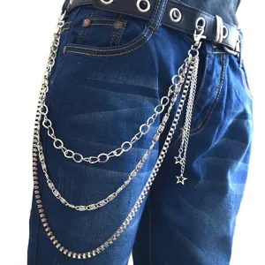 Close-up detail shot of silver tone metal hip hop pants chain with trendy star pendants.