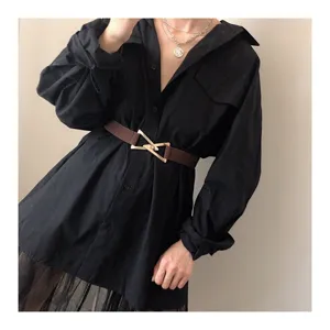 Women elastic waist belt with metal triangle buckle, stylish dress accessory for modern looks.