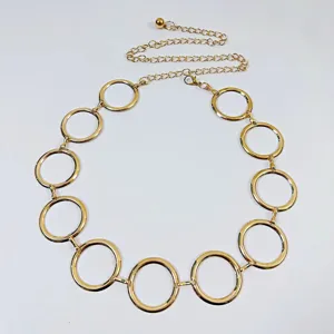 Gold metal ring waist chain belt for women, stylish decorative accessory for dresses and suits.