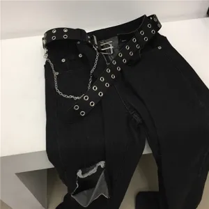 Black punk style ripped jeans with double grommet metal chain belt for streetwear.