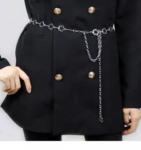 Silver metal clover waist chain, stylish detail shot showing belt accessory for dresses.