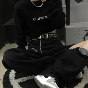 Punk style double grommet black belt with metal chain detail, perfect for edgy street outfits.