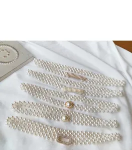 Elegant women's pearl waist chain with sparkling rhinestones and elastic stretch design for dresses.
