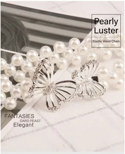 Rhinestone butterfly pearl waist chain detail showing sparkling crystal and bead texture.