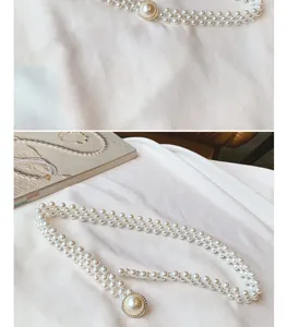 Close-up detail of the elegant multi-strand pearl waist chain with a sparkling diamond buckle.