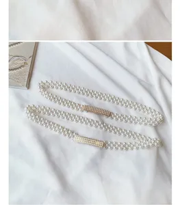Elegant pearl waist chain for women with rhinestone buckle, perfect elastic dress belt.