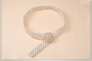 Elegant multi-row pearl waist belt with sparkling rhinestone buckle for dress styling.