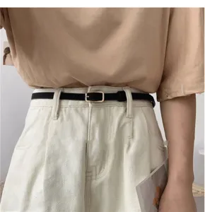 Minimalist black thin belt for women with metal buckle elegant waist accessory detail view