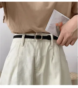 Minimalist thin black belt for women, versatile metal buckle waist belt for jeans and skirts.