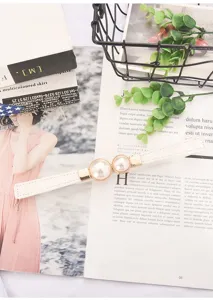 Elegant white thin waist belt with luxury double pearl buckle and gold metal accents for women dress.