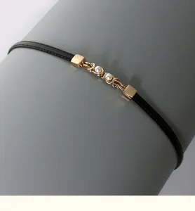 Black thin PU leather waist belt with elegant gold metal and pearl link detail for dress.