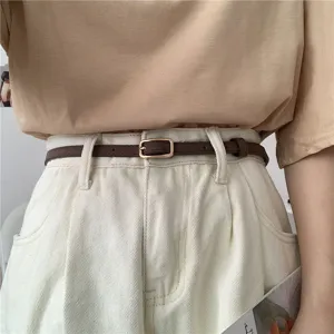 Minimalist thin leather belt for women, retro waist strap, versatile pants accessory.