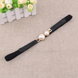 Elegant women's black elastic waist belt featuring a chic double faux pearl gold buckle.
