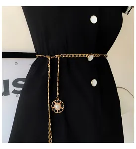 Women gold chain waist belt with elegant camellia pearl pendant, chic metal dress accessory.