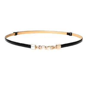 Women black skinny belt with gold buckle and pearl decoration chic PU leather waist belt.