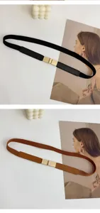 Détails en gros plan de la ceinture élastique avec boucle en métal, style élégant.