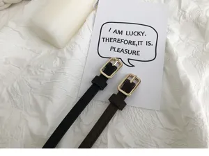 Minimalist thin leather belt detail, slim design with gold rectangular buckle for women daily wear.