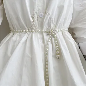 Elegant women pearl waist belt with rhinestone star buckle, sweet vintage dress decor accessory.