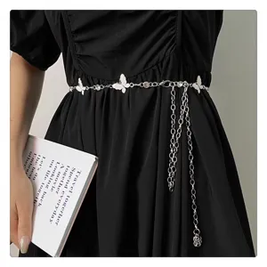 Detailed view of silver butterfly waist chain, elegant metal belt accessory for dresses.