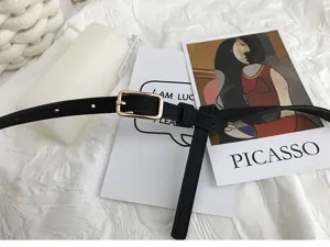 Minimalist black thin belt with gold square buckle, stylish accessory for jeans and trousers.