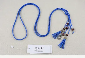 Blue braided tassel waist rope detail, featuring decorative wooden beads and chic ethnic design.