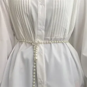 Elegant pearl waist chain for women with floral metal buckle, perfect dress accessory.
