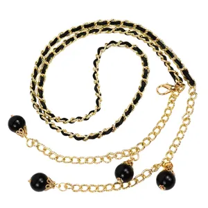 Women gold metal chain belt with black leather weaving and pearl charms for stylish dress styling.