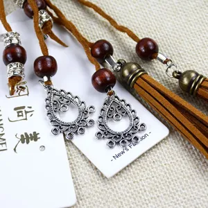 Bohemian ethnic waist chain for women with wooden beads and tassels, stylish dress belt.
