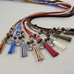 Bohemian handmade braided waist belt with tassels, wooden beads and metal pendants for women.
