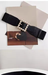 Stylish black elastic waist belt with elegant square pearl buckle for women dresses.