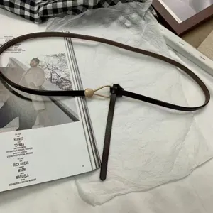 Slim women dress belt thin PU leather knot waist belt for stylish dresses and sweaters.
