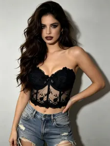 Black mesh embroidered corset bustier top with distressed denim shorts for women.