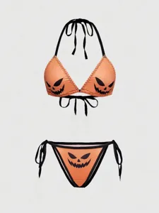 Lindo conjunto de bikini halter con estampado de cara de calabaza de Halloween y estilo.