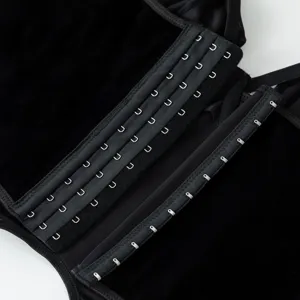 Detailed view of black velvet gothic corset top, featuring secure metal hook-and-eye closure.
