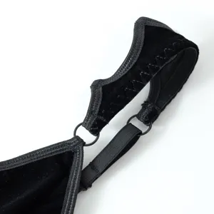 Gothic black velvet camisole strap detail showing metal ring and adjustable elastic band.