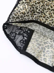 Close-up view of sexy leopard print fabric combined with delicate black lace trim and elastic.