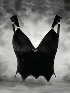 Detailed view of black velvet gothic corset top with bat wing hem and silver bat charm accent.