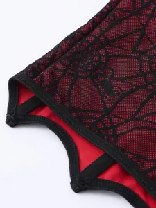 Nahaufnahme von rotem und schwarzem Mesh Spinnennetz Korsett Stoff und Besatz.
