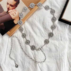 Vintage silver metal coin chain belt for women, chic hollow-out disc waist jewelry.