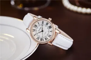 Elegant women quartz watch with white leather strap, rose gold rhinestone bezel and Roman numerals.