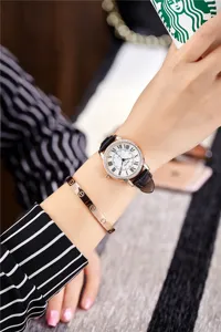 Women's quartz watch with black leather strap, Roman numerals and sparkly rhinestone bezel.