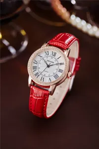 Red strap rhinestone quartz watch for women with Roman numerals and elegant rose gold case.